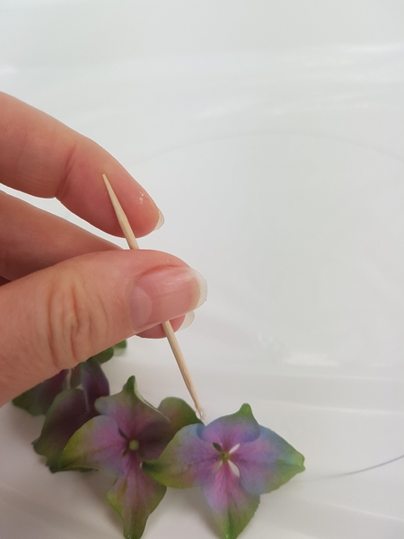 As you build up the wreath make sure you glue each floret at, at least 3 places to another floret. As you build up the wreath make sure you glue each floret at, at least 3 places to another floret.