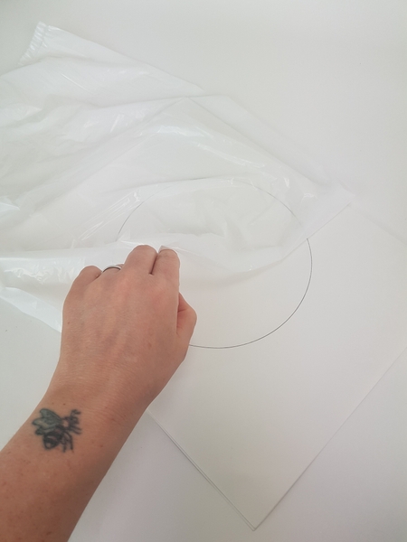 Cover the circle with plastic. Cover the circle with plastic.