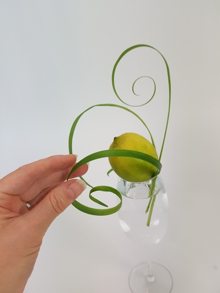 I curled a few blades of grass. See the Tutorial below for more detailed instructions on how to curl grass. I curled a few blades of grass. See the Tutorial below for more detailed instructions on how to curl grass.