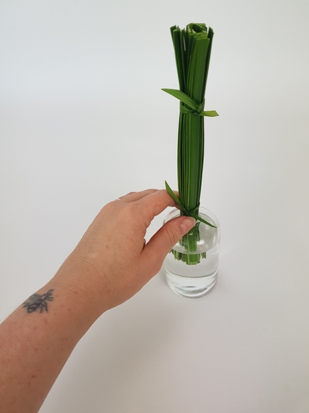 Set the bundle in the container filled with water