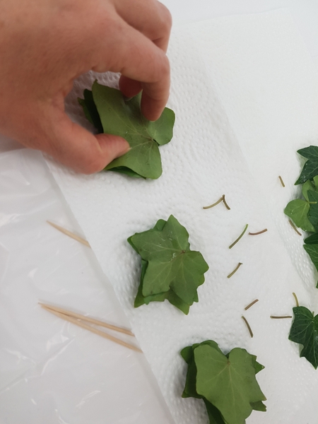 Stack the leaves. Seven or eight leaves should be enough for each stack. Stack the leaves. Seven or eight leaves should be enough for each stack.