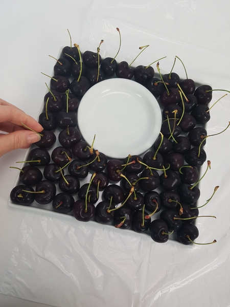 Turn the cherries so that the stems point up. Turn the cherries so that the stems point up.