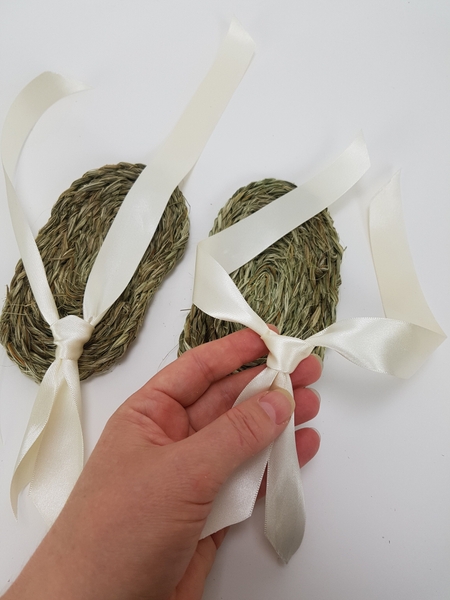 Cut two sections of ribbon for each sandal. Cut two sections of ribbon for each sandal.