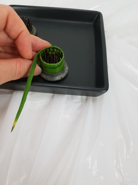 On the last wrap let the leaf extend higher than the teeth to make sure you conceal the kenzan. On the last wrap let the leaf extend higher than the teeth to make sure you conceal the kenzan.