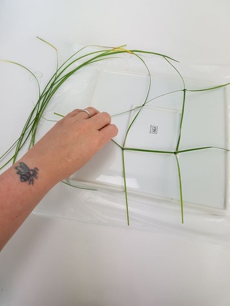 When you have a knotted square you are ready to turn the container over. When you have a knotted square you are ready to turn the container over.