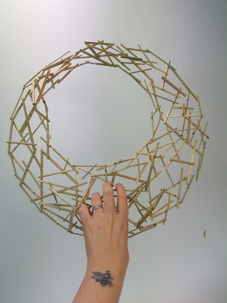 Hold the wreath up to make sure it is sturdy Hold the wreath up to make sure it is sturdy