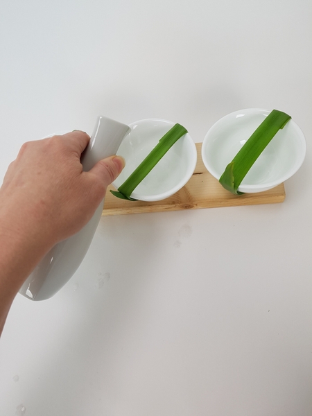 Fill the containers with water Fill the containers with water