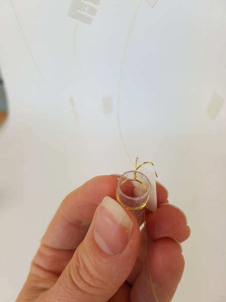 Wire the tubes and simply create feelers to hook over the clip Wire the tubes and simply create feelers to hook over the clip