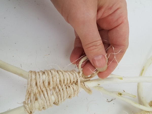 Knot the rope to secure at the end of the winding pattern