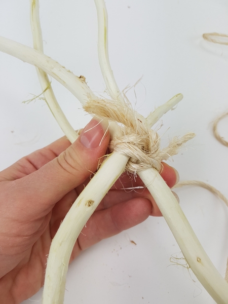 Slip the end of a sisal rope through the knot to secure Slip the end of a sisal rope through the knot to secure