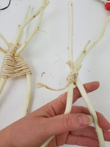 Tie a second pair of twigs Tie a second pair of twigs