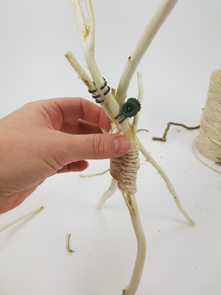 Turn the v upside down and glue in a third stem to make it stand upright Turn the v upside down and glue in a third stem to make it stand upright