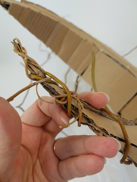 Wrap the willow to closely follow the cardboard shape Wrap the willow to closely follow the cardboard shape