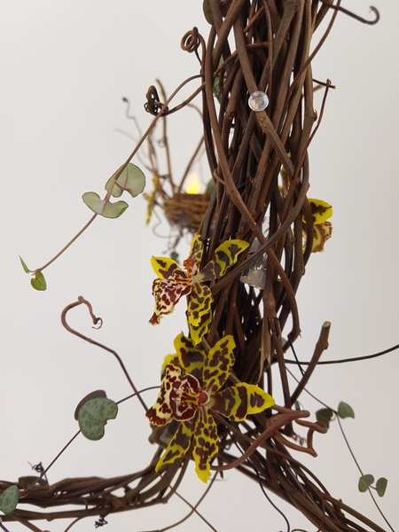 Chandelier flower arrangement with rosary vine Chandelier flower arrangement with rosary vine