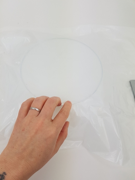 Cover the display container with plastic to catch drips of glue Cover the display container with plastic to catch drips of glue