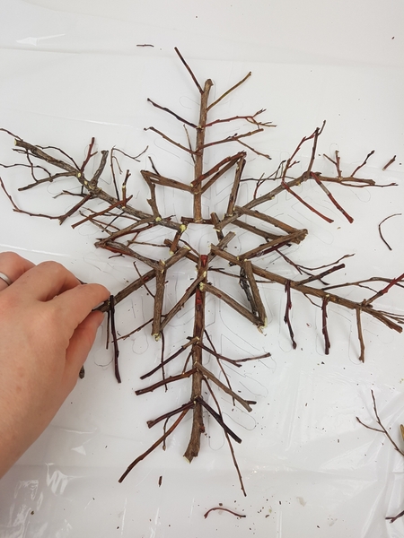 Glue in the icicles at the end of the longer twigs