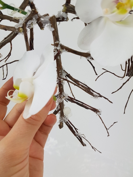 Glue in tiny water tubes to keep the fresh flowers hydrated Glue in tiny water tubes to keep the fresh flowers hydrated