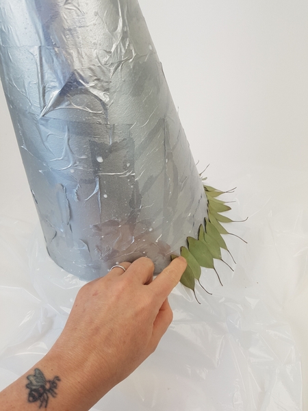 Glue leaves around the cone shape Glue leaves around the cone shape