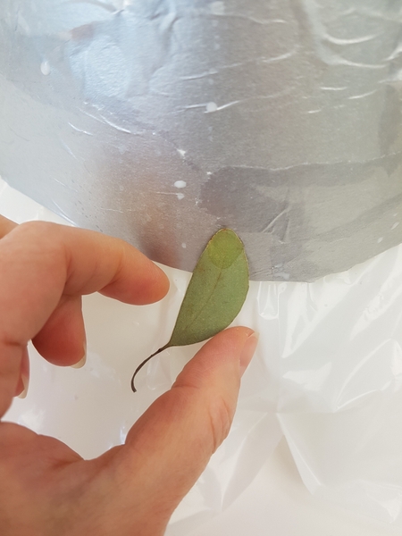 Glue the leaves to the cone shape Glue the leaves to the cone shape