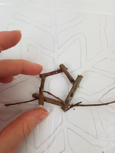 Overlap the ends of the twigs to make sure they are glued securely in place Overlap the ends of the twigs to make sure they are glued securely in place