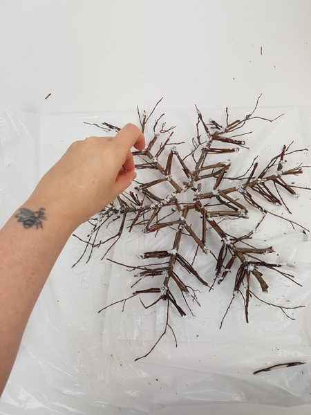 Sprinkle the twig snowflake with artificial snow Sprinkle the twig snowflake with artificial snow