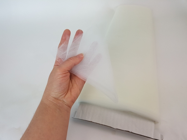 Cut the tulle into a disk slightly bigger than the basket Cut the tulle into a disk slightly bigger than the basket