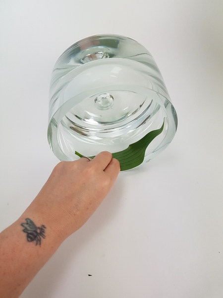 Place the container on its side to make it easier to stack the foliage in the container Place the container on its side to make it easier to stack the foliage in the container