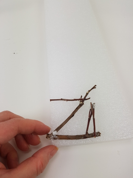 Glue twigs to create a screen