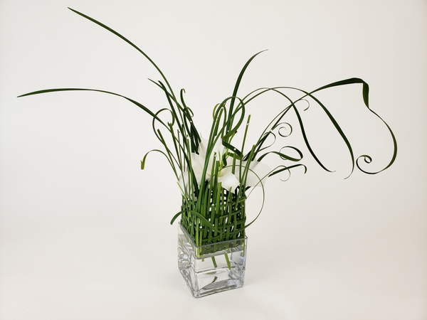 Lily and lily grass flower arrangement.