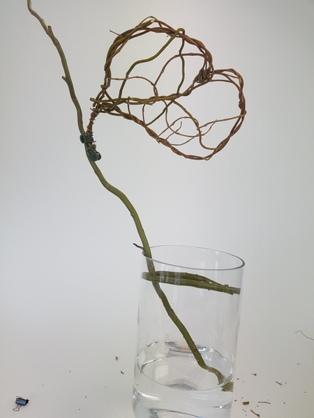 Place the heart shape on the twig Place the heart shape on the twig