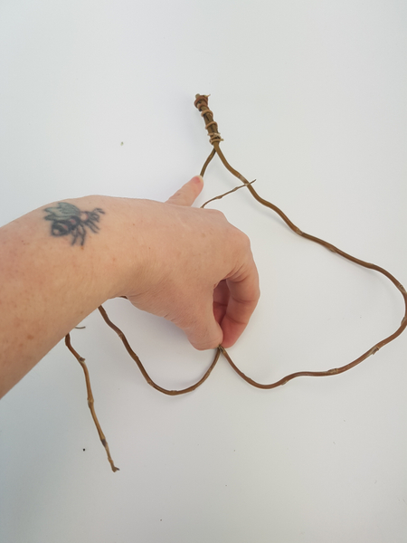 Shape the two willow twigs to create a heart