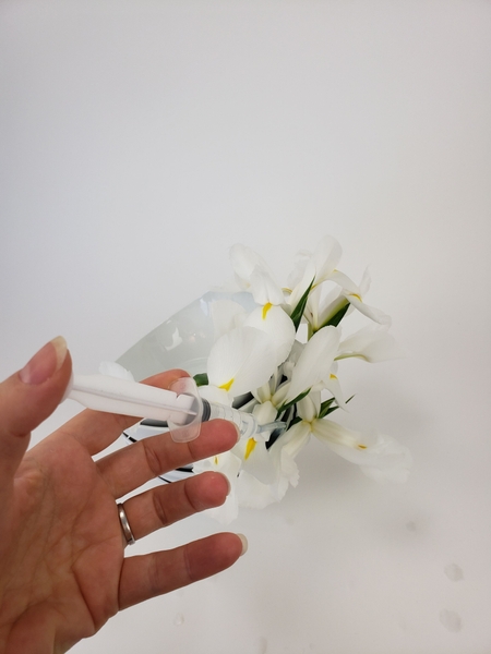 Top up the water to make sure the flowers remain hydrated Top up the water to make sure the flowers remain hydrated