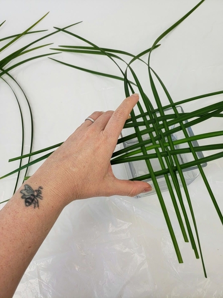 Weave a few blades of grass. Weave a few blades of grass.