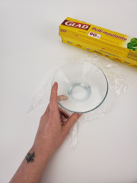 Place some clingfilm over the container Place some clingfilm over the container