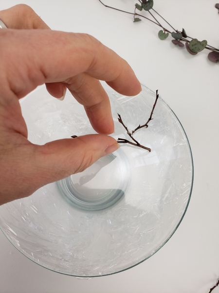 Place the twigs on the cling film Place the twigs on the cling film