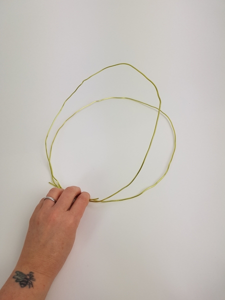 Shape the wire to loop twice Shape the wire to loop twice