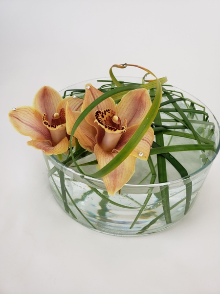 Cymbidium and lily grass floral design Cymbidium and lily grass floral design