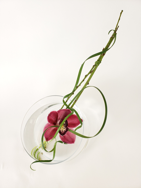 Cymbidium orchid and lily grass floral design