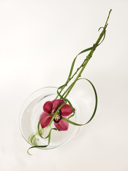 Cymbidium orchid and lily grass floral design Cymbidium orchid and lily grass floral design