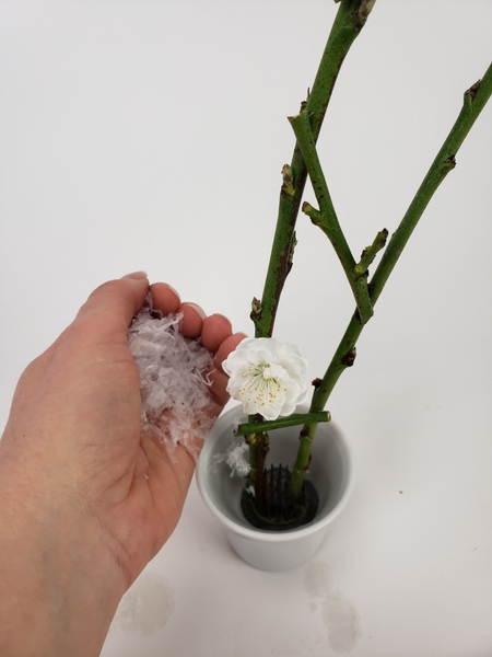 Scatter artificial snow to float on the water and hide the mechanics Scatter artificial snow to float on the water and hide the mechanics