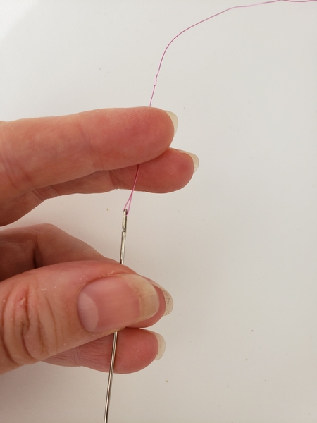 Thread the wire through the eye of a lei making needle Thread the wire through the eye of a lei making needle