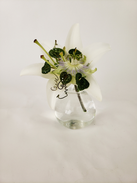 A trumpet shaped lily floral design