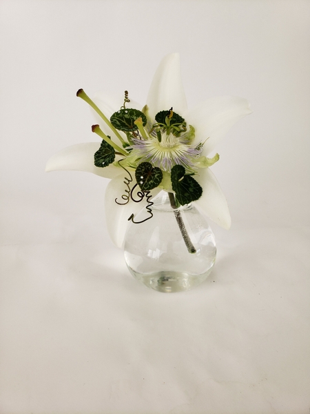 A trumpet shaped lily floral design A trumpet shaped lily floral design
