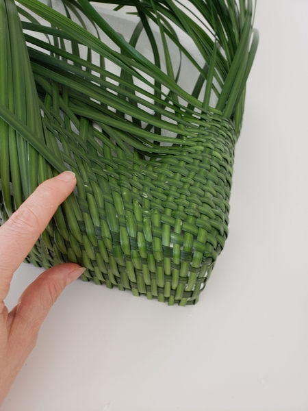 Build up the weaving pattern to curve smoothly over the edge of the block Build up the weaving pattern to curve smoothly over the edge of the block