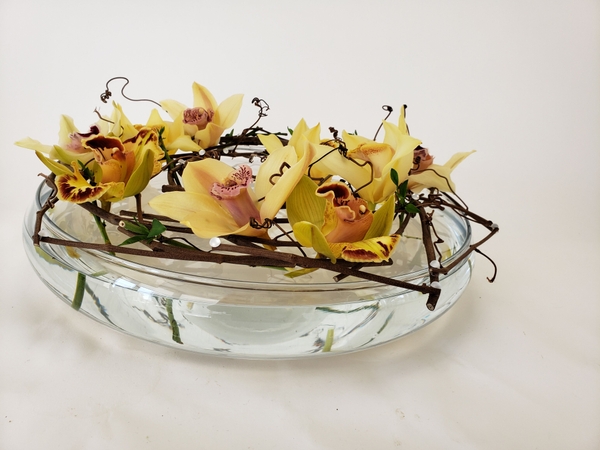 Designing with short stem flowers in a shallow container. Designing with short stem flowers in a shallow container.