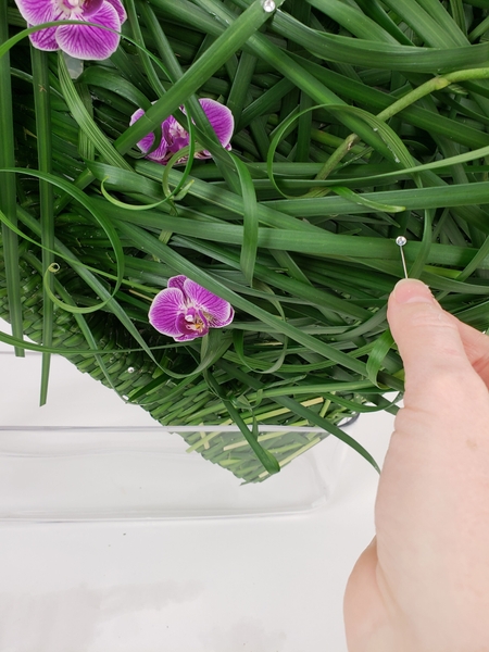 Place the flowers in fresh water tubes and add a few dew drop crystals