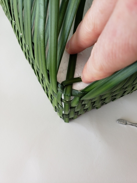 To follow the weaving pattern to the front cross the corner most blades of grass over To follow the weaving pattern to the front cross the corner most blades of grass over