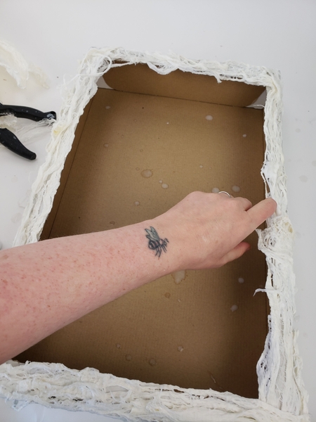 Create some dimension by allowing some of the bark pieces to bubble up and extend over the edge of the box Create some dimension by allowing some of the bark pieces to bubble up and extend over the edge of the box