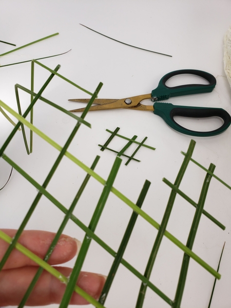 Cut the grid so that you can slip it in and around the flowers Cut the grid so that you can slip it in and around the flowers