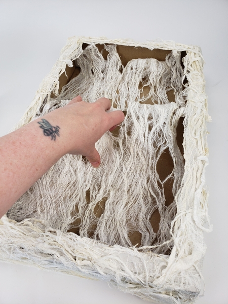 Place a sheet of the bark inside the box and glue it every here and there. Place a sheet of the bark inside the box and glue it every here and there.